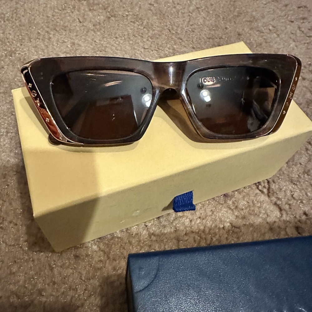 Authentic Louis Vuitton sunglasses. Brand new in a box with dust cover.